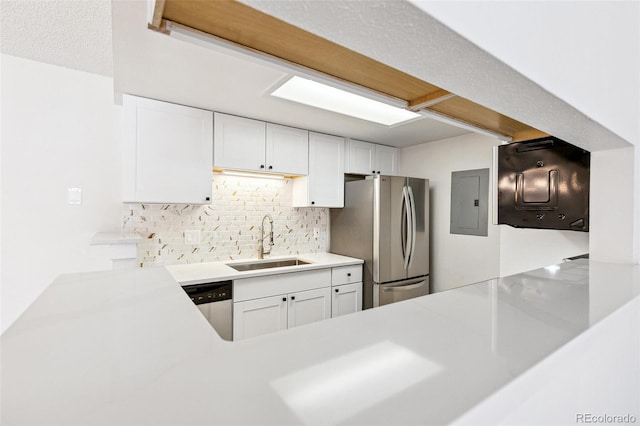 18302 E Kepner Pl Unit 207, Aurora, CO 80017 - kitchen with appliances with stainless steel finishes, decorative backsplash, electric panel, white cabinets, and light countertops