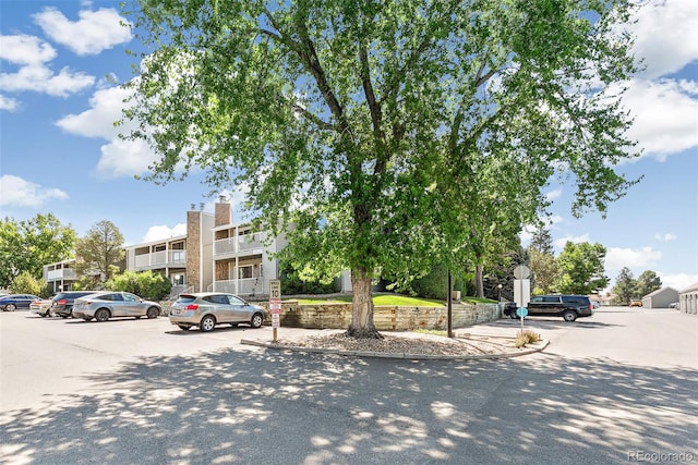 18302 E Kepner Pl Unit 207, Aurora, CO 80017 - view of building exterior with uncovered parking