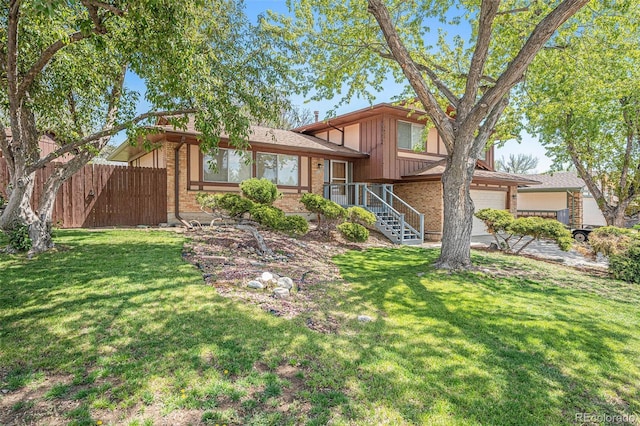 12289 W Atlantic Ave, Lakewood, CO 80228 - view of front of home featuring brick siding, board and batten siding, and concrete driveway