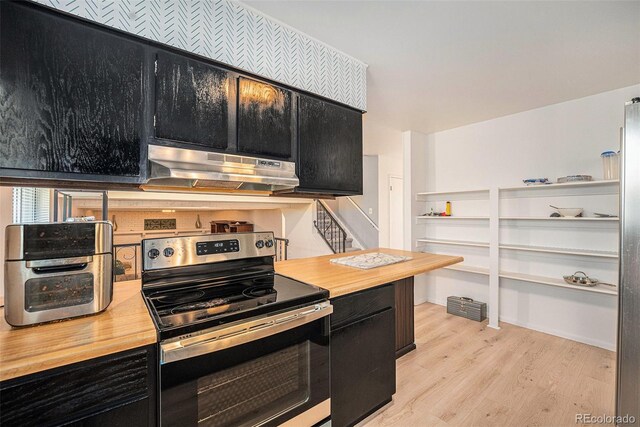 12289 W Atlantic Ave, Lakewood, CO 80228 - kitchen with dark cabinetry, stainless steel electric stove, and under cabinet range hood