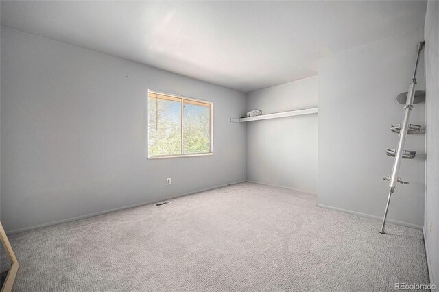 12289 W Atlantic Ave, Lakewood, CO 80228 - unfurnished room with carpet flooring and baseboards