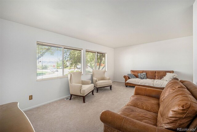 12289 W Atlantic Ave, Lakewood, CO 80228 - living room featuring plenty of natural light, light colored carpet, and baseboards