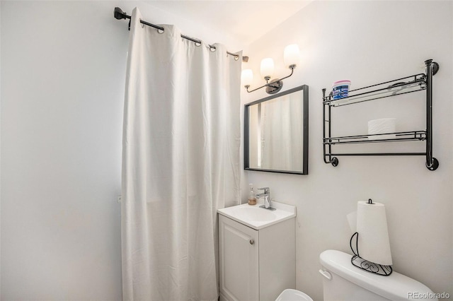 12289 W Atlantic Ave, Lakewood, CO 80228 - full bath featuring toilet, vanity, and curtained shower