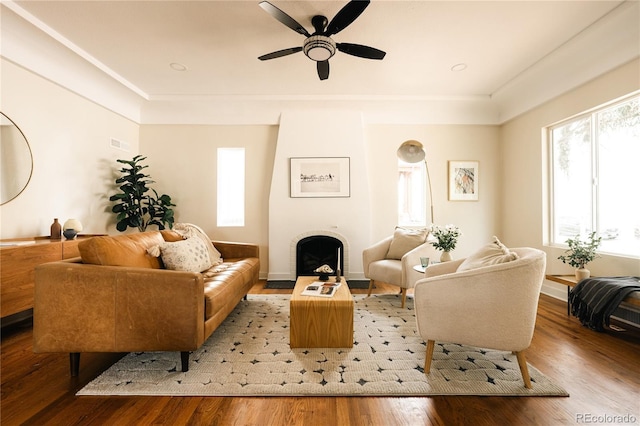 1219 Cherry St, Denver, CO 80220 - living room with a fireplace, light wood-style floors, a ceiling fan, and baseboards