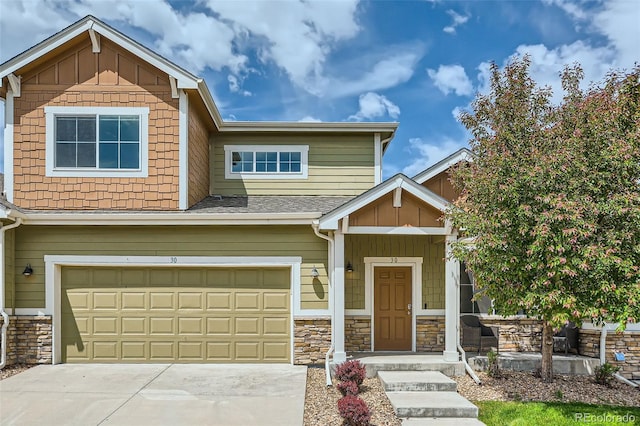 6024 W 1st St Unit 30, Greeley, CO 80634 - craftsman house with stone siding, an attached garage, concrete driveway, and board and batten siding
