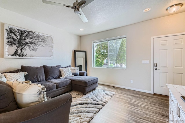 6024 W 1st St Unit 30, Greeley, CO 80634 - living room with a ceiling fan, wood finished floors, baseboards, a textured ceiling, and recessed lighting