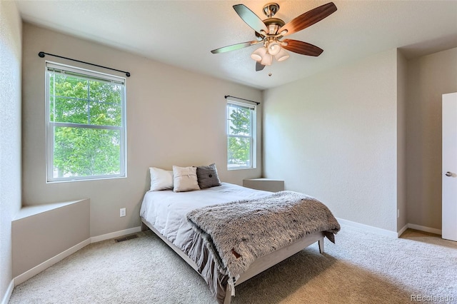 6024 W 1st St Unit 30, Greeley, CO 80634 - bedroom with light carpet, baseboards, and ceiling fan