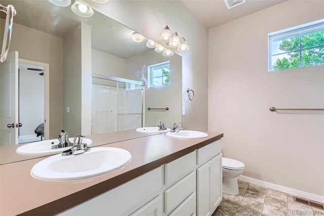 6024 W 1st St Unit 30, Greeley, CO 80634 - full bath featuring a shower stall, double vanity, toilet, and healthy amount of natural light