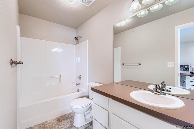 6024 W 1st St Unit 30, Greeley, CO 80634 - bathroom featuring toilet, washtub / shower combination, and vanity