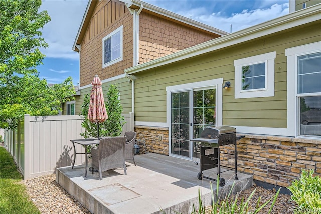 6024 W 1st St Unit 30, Greeley, CO 80634 - back of property with stone siding and a patio area