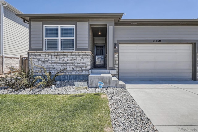13460 Broad Wing Ave, Parker, CO 80134 - view of front of house featuring stone siding, concrete driveway, a garage, and a front lawn