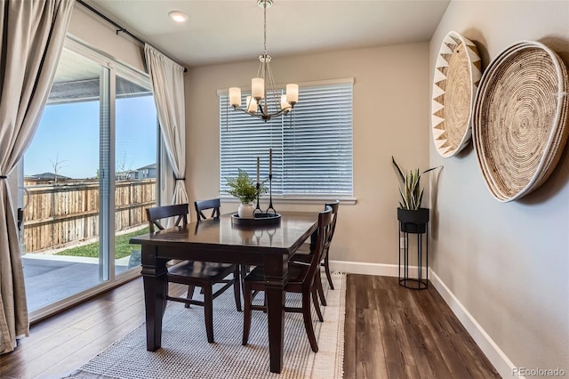 13460 Broad Wing Ave, Parker, CO 80134 - dining room featuring a chandelier, dark wood-style flooring, healthy amount of natural light, baseboards, and recessed lighting