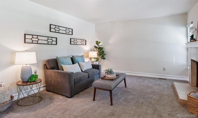 carpeted living room with a fireplace