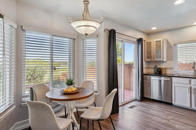 dining area featuring light hardwood / wood-style flooring and sink