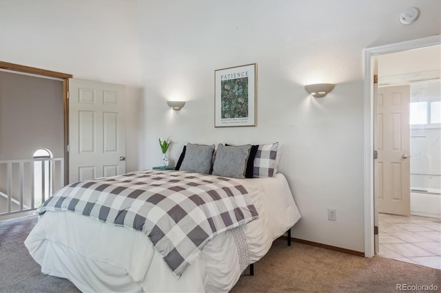 carpeted bedroom featuring connected bathroom