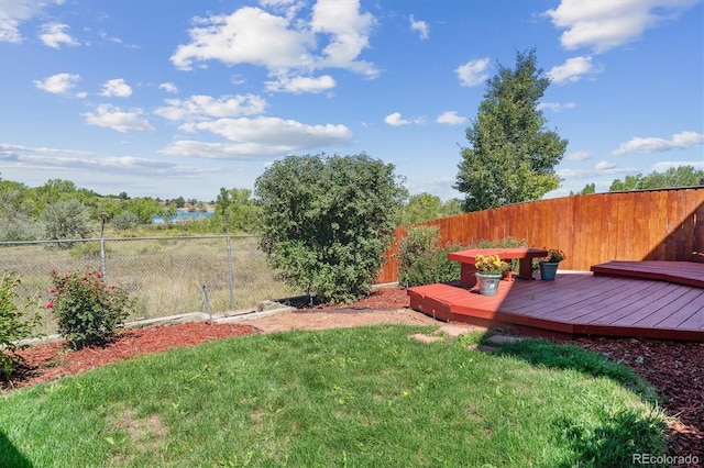 view of yard with a deck