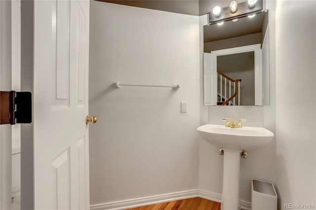 bathroom with sink and hardwood / wood-style floors