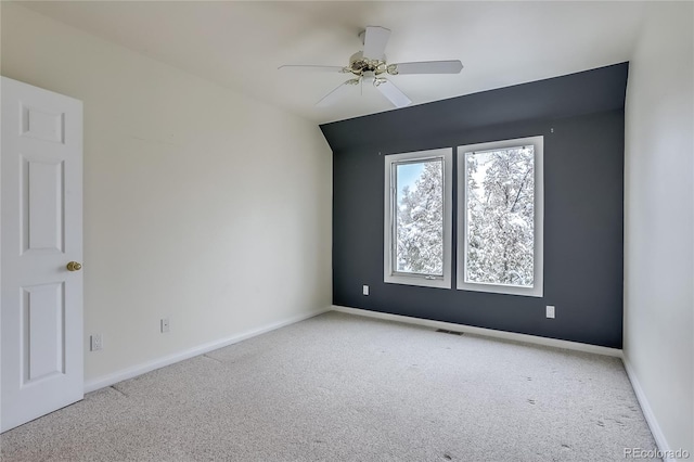 unfurnished room with ceiling fan and light colored carpet