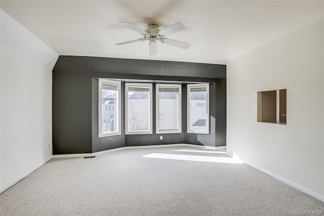 interior space with ceiling fan and carpet