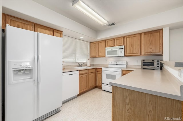 kitchen with white appliances and sink