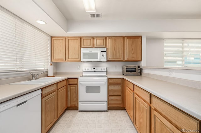 kitchen with white appliances and sink