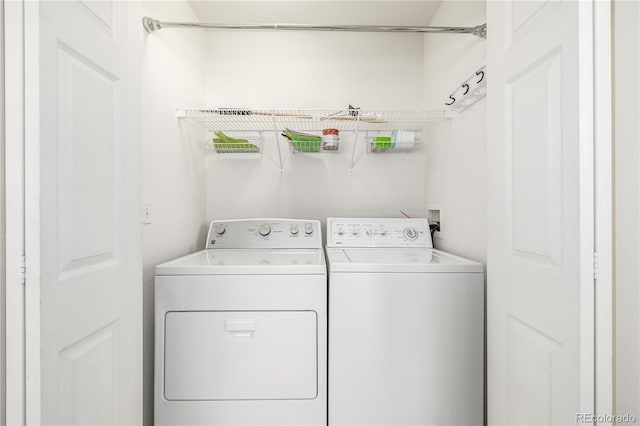 laundry area with washing machine and dryer