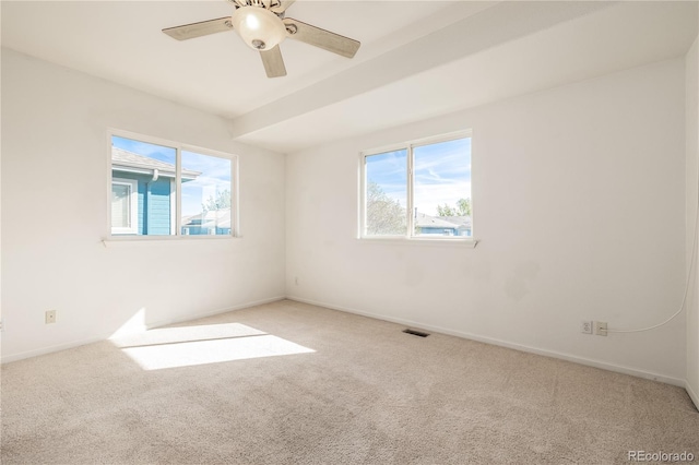 unfurnished room with ceiling fan and light colored carpet