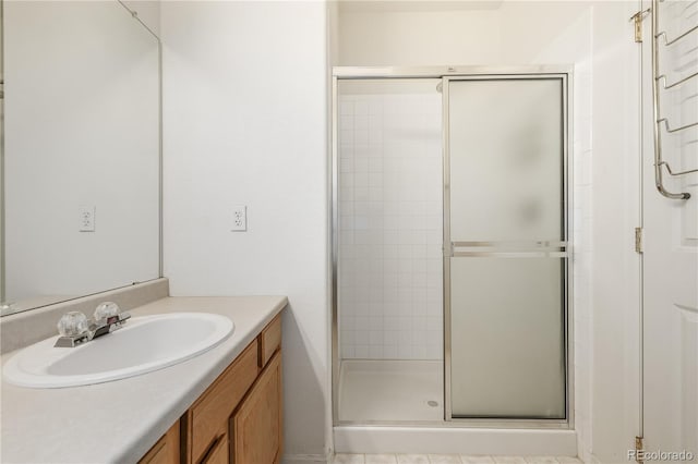 bathroom with vanity and walk in shower