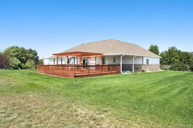 back of house featuring a deck and a yard