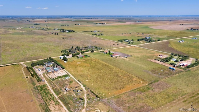 birds eye view of property with a rural view