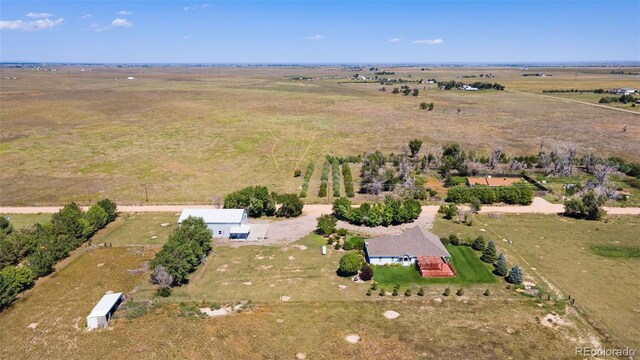 birds eye view of property featuring a rural view