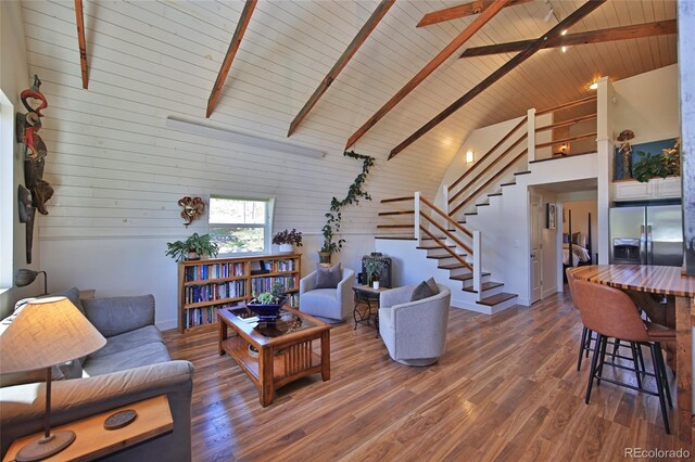 57191 Me Rd, Collbran, CO 81624 - living room with stairway, high vaulted ceiling, wooden ceiling with exposed beams, wood finished floors, and wooden walls