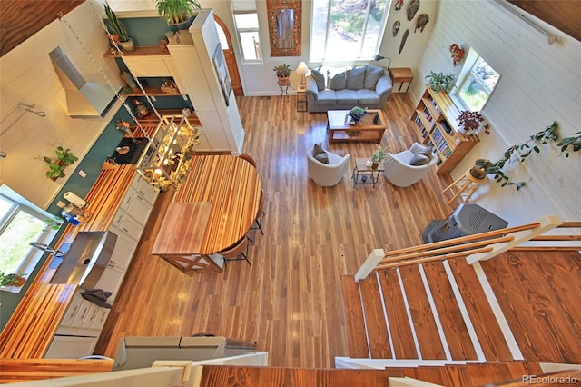 57191 Me Rd, Collbran, CO 81624 - living room with wood finished floors, wood walls, and a towering ceiling