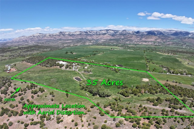 57191 Me Rd, Collbran, CO 81624 - aerial view of sparsely populated area featuring mountains and property boundaries highlighted