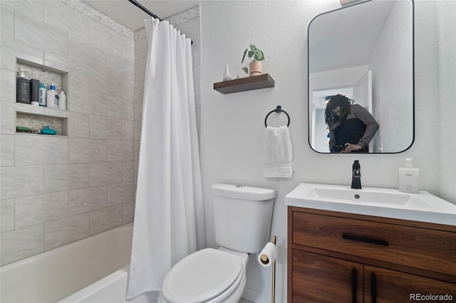5170 Deephaven Ct, Denver, CO 80239 - bathroom featuring vanity, toilet, and shower / bath combo with shower curtain
