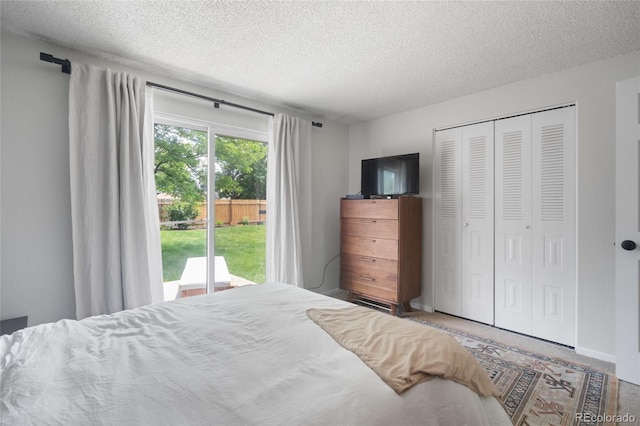 5170 Deephaven Ct, Denver, CO 80239 - bedroom with a textured ceiling, a closet, and access to exterior