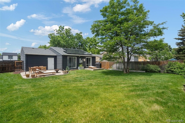 5170 Deephaven Ct, Denver, CO 80239 - rear view of property with solar panels and a patio area