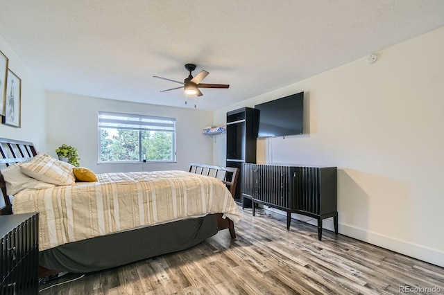 610 S Clinton St Unit 8C, Denver, CO 80247 - bedroom featuring wood finished floors and ceiling fan