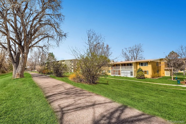 610 S Clinton St Unit 8C, Denver, CO 80247 - view of property's community featuring a lawn