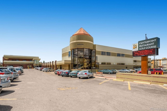 610 S Clinton St Unit 8C, Denver, CO 80247 - view of commercial property with uncovered parking