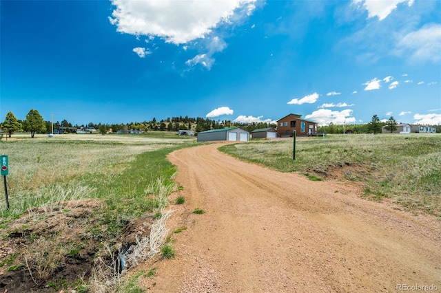 85 Estes Cir, Florissant, CO 80816 - view of dirt / gravel road featuring a rural view