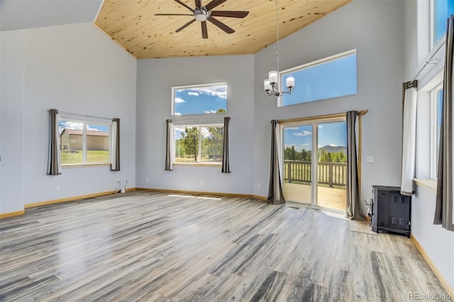 85 Estes Cir, Florissant, CO 80816 - unfurnished living room with high vaulted ceiling, wood finished floors, ceiling fan, a chandelier, and wood ceiling