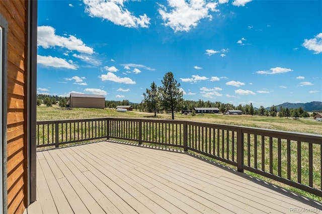 85 Estes Cir, Florissant, CO 80816 - deck featuring a mountain view and an outbuilding