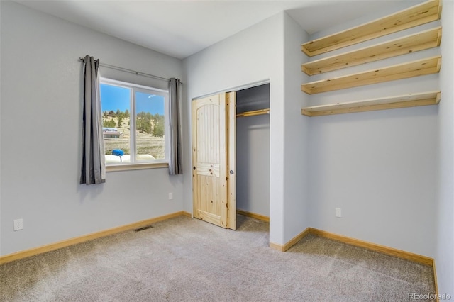 85 Estes Cir, Florissant, CO 80816 - unfurnished bedroom featuring carpet flooring, baseboards, and a closet