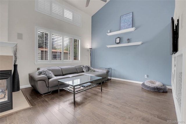 10540 Tracewood Cir, Highlands Ranch, CO 80130 - living area with high vaulted ceiling, wood finished floors, and ceiling fan