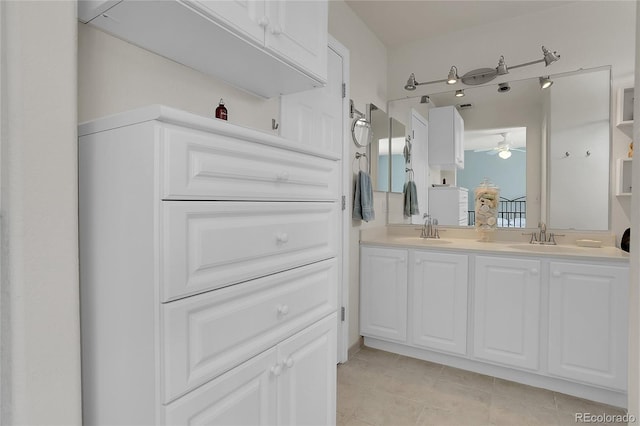 10540 Tracewood Cir, Highlands Ranch, CO 80130 - bathroom with a ceiling fan, double vanity, and tile patterned floors