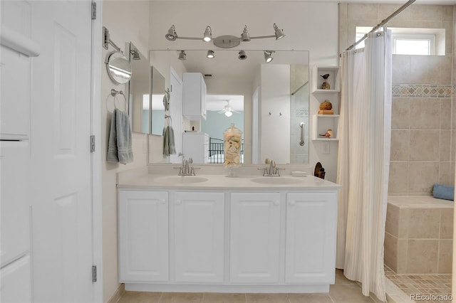 10540 Tracewood Cir, Highlands Ranch, CO 80130 - bathroom featuring tiled shower, a ceiling fan, tile patterned floors, and double vanity