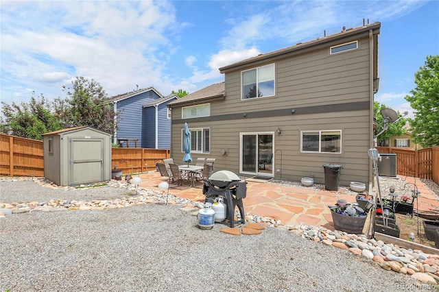10540 Tracewood Cir, Highlands Ranch, CO 80130 - back of house featuring a shed, a fenced backyard, a patio, and outdoor dining space