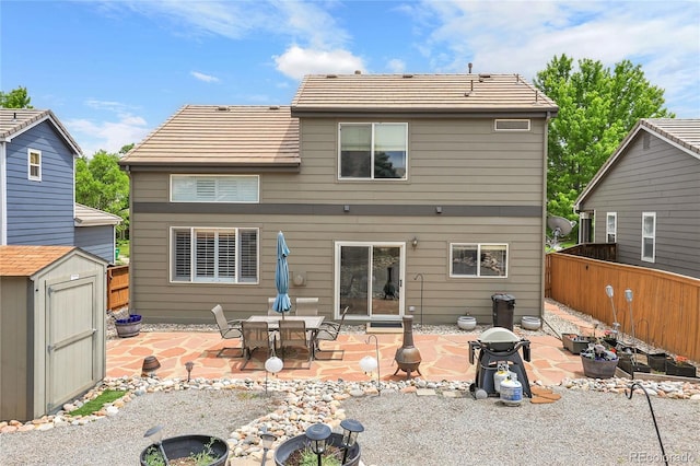 10540 Tracewood Cir, Highlands Ranch, CO 80130 - rear view of property featuring a shed, a patio, and a tile roof