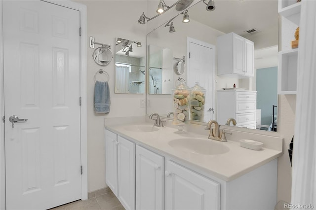 10540 Tracewood Cir, Highlands Ranch, CO 80130 - bathroom with double vanity and tile patterned floors